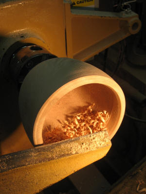 A bowl is being created on the lathe
